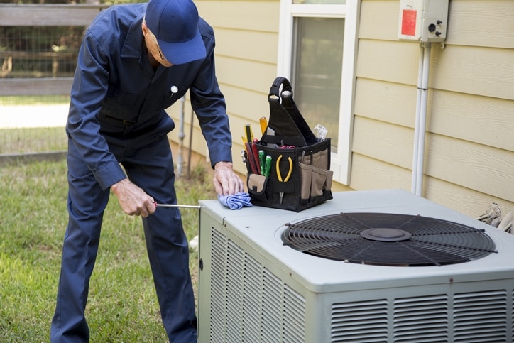 man performing ac tune up