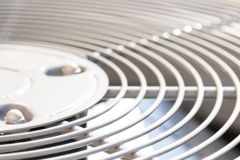5 Reasons Why Regular HVAC Maintenance is Essential for Homeowners. The top of an air conditioner.