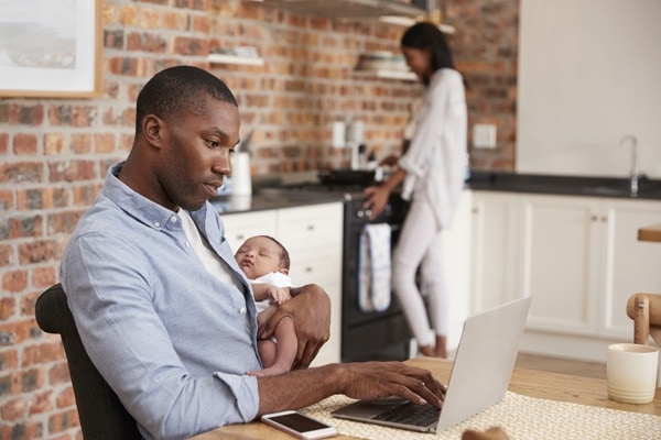 Father and kid on laptop.